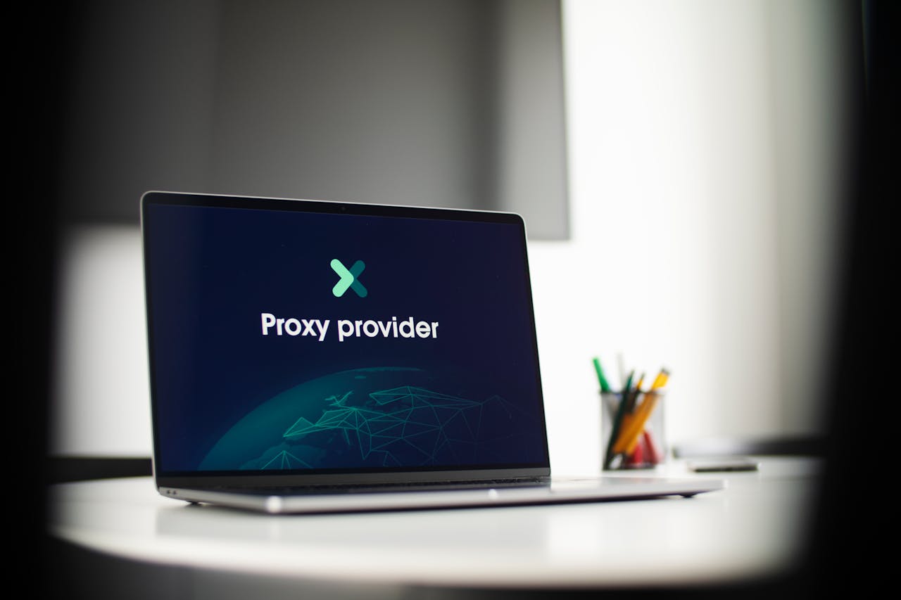 services-01 Laptop screen showing 'Proxy provider' in a tech office setting, focus on cybersecurity.
